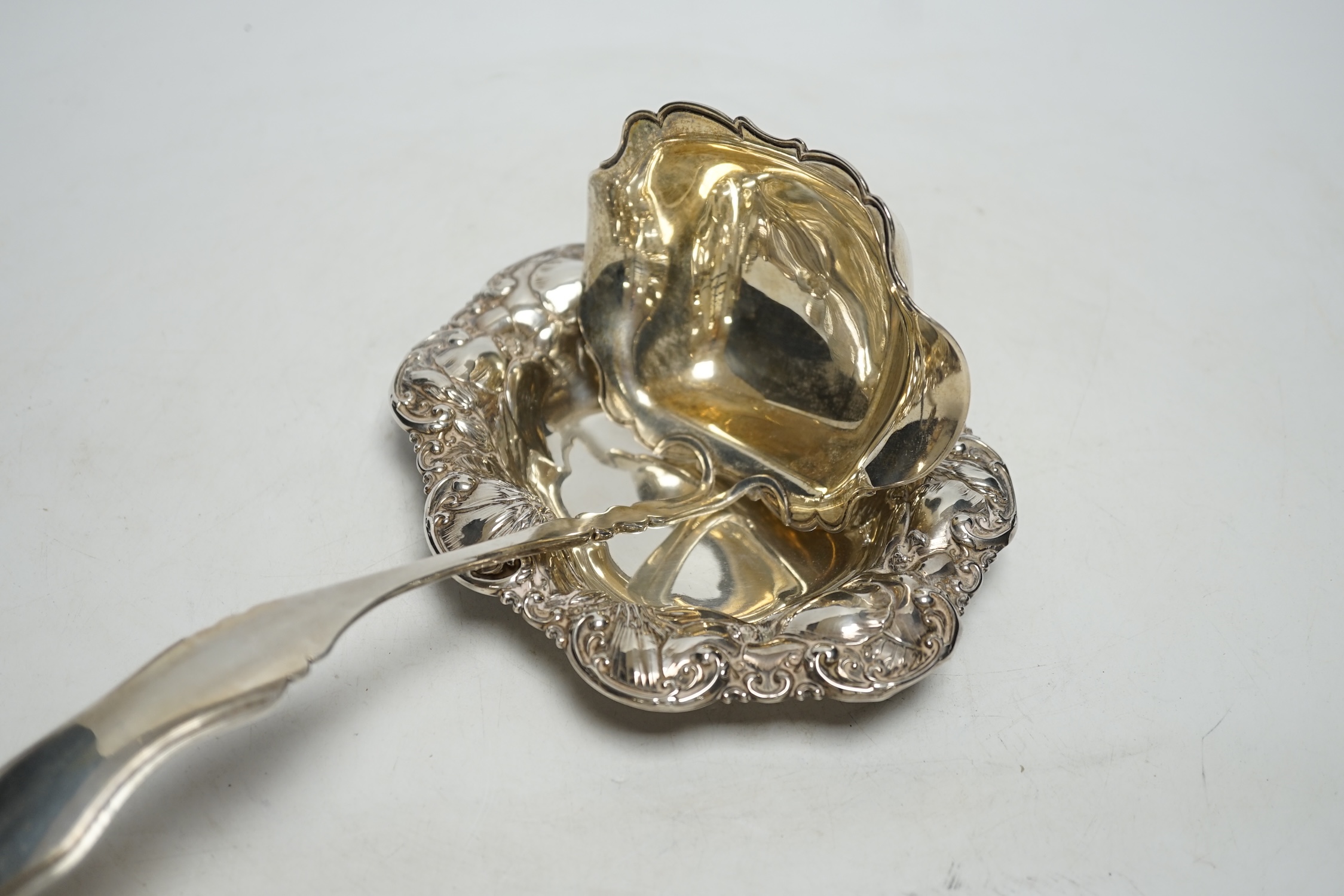 A Dutch white metal soup ladle, 29.5cm and a sterling small dish, 9.3oz.